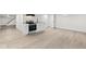 Basement studio apartment with luxury vinyl plank flooring and a kitchenette at 3716 W 16Th St, Indianapolis, IN 46222