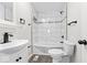 Updated bathroom featuring modern fixtures, a tiled shower, and vinyl flooring at 3716 W 16Th St, Indianapolis, IN 46222