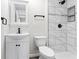 Modern bathroom featuring updated tiling, fixtures, and vanity at 3716 W 16Th St, Indianapolis, IN 46222