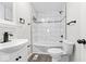 Modern bathroom featuring updated tiling, fixtures, and vanity at 3716 W 16Th St, Indianapolis, IN 46222