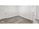Spacious bedroom with modern vinyl plank flooring, white trim and baseboards at 3716 W 16Th St, Indianapolis, IN 46222
