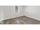 Bedroom with wood-look flooring and neutral walls at 3716 W 16Th St, Indianapolis, IN 46222