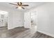 Spacious bedroom with gray flooring, a ceiling fan, and two doorways at 3716 W 16Th St, Indianapolis, IN 46222