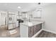 Modern kitchen featuring stainless steel appliances, gray countertops, and stylish wood accents at 3716 W 16Th St, Indianapolis, IN 46222