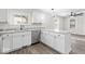 Bright kitchen with stainless steel appliances and granite countertops and white cabinetry at 3716 W 16Th St, Indianapolis, IN 46222
