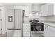 Bright kitchen with stainless steel appliances, granite countertops, and modern cabinets at 3716 W 16Th St, Indianapolis, IN 46222