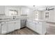 Bright kitchen with gray countertops, stainless steel appliances, and ample cabinet space at 3716 W 16Th St, Indianapolis, IN 46222