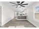 Open-concept layout with wood-look floors connects the living room to the kitchen at 3716 W 16Th St, Indianapolis, IN 46222