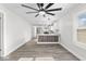 Open-concept living room flowing into a modern kitchen with gray floors throughout at 3716 W 16Th St, Indianapolis, IN 46222