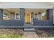 Charming front porch featuring brick columns, a neutral color palette, and inviting curb appeal at 3716 W 16Th St, Indianapolis, IN 46222