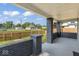 Welcoming covered porch featuring decorative brick columns and a fenced yard view at 3716 W 16Th St, Indianapolis, IN 46222