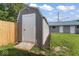 Backyard shed with double doors and walkway at 3716 W 16Th St, Indianapolis, IN 46222