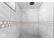 New tiled shower featuring a unique design and shower head at 3716 W 16Th St, Indianapolis, IN 46222