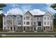 Charming new construction townhomes featuring varied facade designs, brick accents, and inviting front entrances at 410 Elite St # 2-602, Westfield, IN 46074