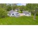 A bird's eye view reveals the inviting deck and the property's layout with its neat landscaping at 425 Patterson Rd, Columbus, IN 47203