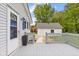 Charming back deck and white detached garage providing extra storage and functionality to the property at 425 Patterson Rd, Columbus, IN 47203