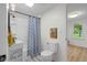 Modern bathroom design features a sink, toilet and tub with patterned shower curtain at 425 Patterson Rd, Columbus, IN 47203