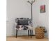 Cozy bedroom corner with stylish chair, throw blanket basket, and modern lamp at 425 Patterson Rd, Columbus, IN 47203