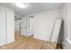 Neutral bedroom with wooden floor and standing mirror at 425 Patterson Rd, Columbus, IN 47203