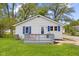 Charming front exterior featuring blue shutters and a quaint front deck at 425 Patterson Rd, Columbus, IN 47203