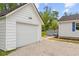 Side view of the detached garage showing the door to the back deck and house at 425 Patterson Rd, Columbus, IN 47203