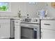 Stainless steel oven against granite countertop with white cabinets at 425 Patterson Rd, Columbus, IN 47203