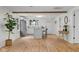 Bright kitchen with white cabinets, wood floors, island, and stainless-steel appliances at 425 Patterson Rd, Columbus, IN 47203