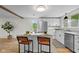 Open concept kitchen with a center island with bar stools and stainless-steel appliances at 425 Patterson Rd, Columbus, IN 47203