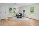 Bright living room with modern furnishings, wood-look floors, and plenty of natural light at 425 Patterson Rd, Columbus, IN 47203