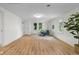 Bright and airy living room with modern decor, wood floors, and ample natural light at 425 Patterson Rd, Columbus, IN 47203