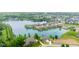 Breathtaking aerial view of lakefront community featuring numerous homes and lush greenery at 4359 Prairie Falcon Dr, Zionsville, IN 46077