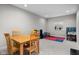 Finished basement features a dining area, window, and carpeted floors at 4359 Prairie Falcon Dr, Zionsville, IN 46077