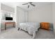 Bedroom with a ceiling fan, window, closet with sliding doors, and carpeted floors at 4359 Prairie Falcon Dr, Zionsville, IN 46077