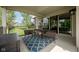 Comfortable covered patio featuring outdoor seating, a stylish rug, and sliding glass doors for seamless indoor/outdoor living at 4359 Prairie Falcon Dr, Zionsville, IN 46077