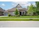 Charming single-story home with brick exterior, landscaped yard, and concrete driveway at 4359 Prairie Falcon Dr, Zionsville, IN 46077