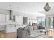 Open kitchen and dining area with hardwood floors and modern light fixtures, perfect for entertaining at 4359 Prairie Falcon Dr, Zionsville, IN 46077