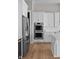 Modern kitchen with stainless steel appliances and white cabinetry for a clean, contemporary design at 4359 Prairie Falcon Dr, Zionsville, IN 46077