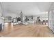 Open-concept layout showcases hardwood floors, a fireplace, and seamless transitions to the kitchen and dining areas at 4359 Prairie Falcon Dr, Zionsville, IN 46077