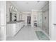 Spacious main bathroom featuring double sinks, neutral colors, and a tiled glass shower at 4359 Prairie Falcon Dr, Zionsville, IN 46077