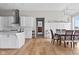 Spacious open-concept kitchen and dining area with hardwood floors and neutral decor at 4359 Prairie Falcon Dr, Zionsville, IN 46077