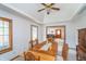 Inviting dining area featuring wood furnishings, neutral decor, and a connecting view to the living room at 4399 Summerhaven Dr, New Palestine, IN 46163