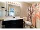 Bathroom featuring a modern vanity with decorative mirror, along with a toilet and shower at 444 Austin Dr, Avon, IN 46123