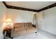 Bedroom featuring a comfortable couch, neutral-colored walls, and a window for natural light at 444 Austin Dr, Avon, IN 46123