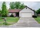Charming single-story home with a well-manicured lawn and a two-car garage at 444 Austin Dr, Avon, IN 46123