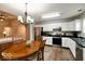 Bright kitchen with stainless steel appliances, white cabinets, and adjacent dining area at 444 Austin Dr, Avon, IN 46123