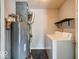 Laundry room featuring a water heater, shelving, and a modern washer and dryer at 444 Austin Dr, Avon, IN 46123