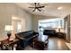 Open-concept living room with modern lighting, wood floors and lots of space for entertaining at 444 Austin Dr, Avon, IN 46123