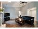 Stylish living room featuring a fireplace, a mounted flatscreen television, and wood flooring at 444 Austin Dr, Avon, IN 46123