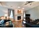 Cozy living room with fireplace, hardwood floors, and comfortable seating at 444 Austin Dr, Avon, IN 46123