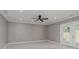 Bedroom with ceiling fan and French doors to the backyard at 4477 Devon Lake Rd, Indianapolis, IN 46226